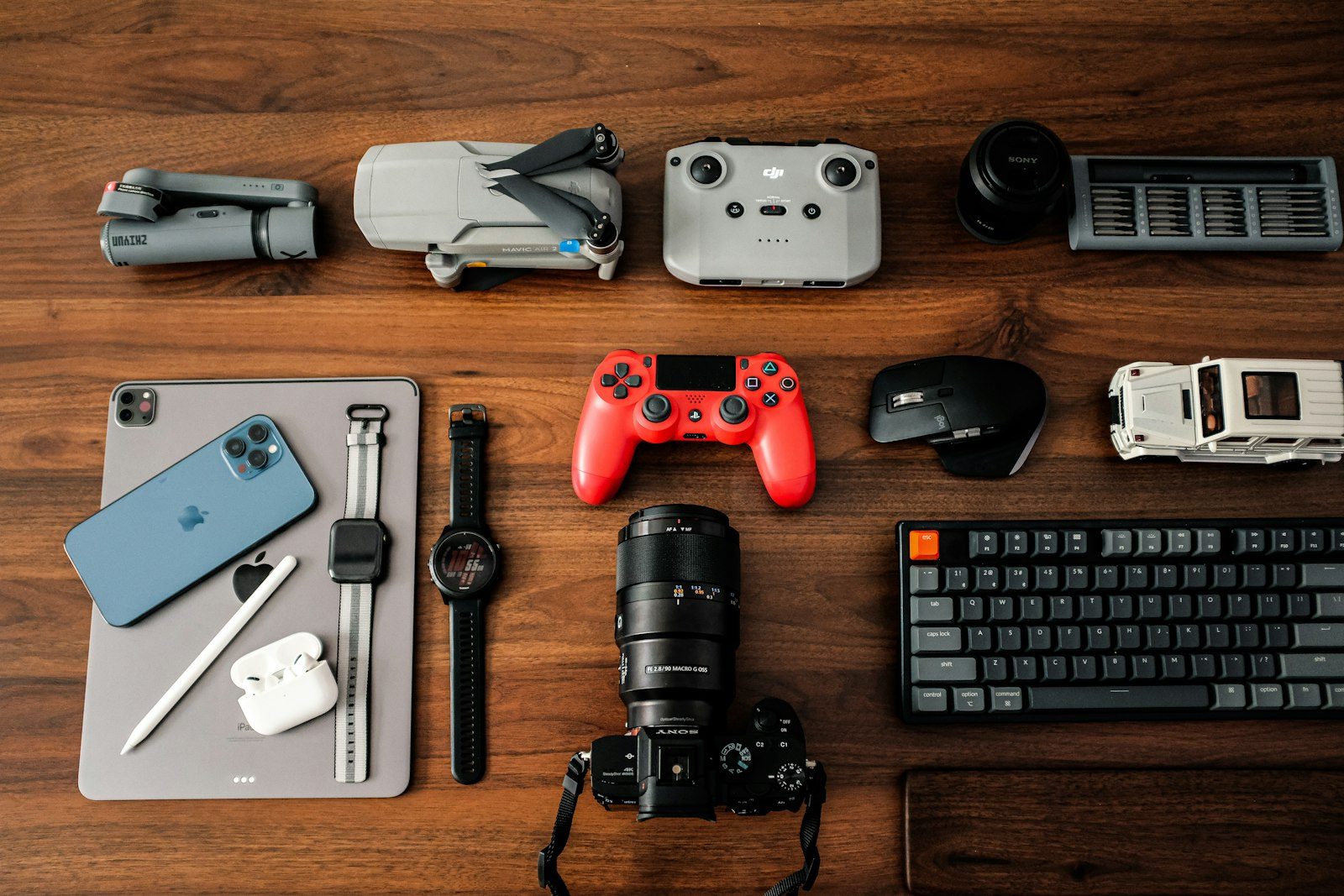 A wooden desk with gaming electronics and a keyboard, the everyday setup where these risks actually show up