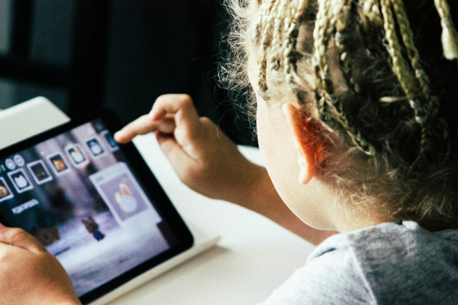 Girl operating a tablet computer